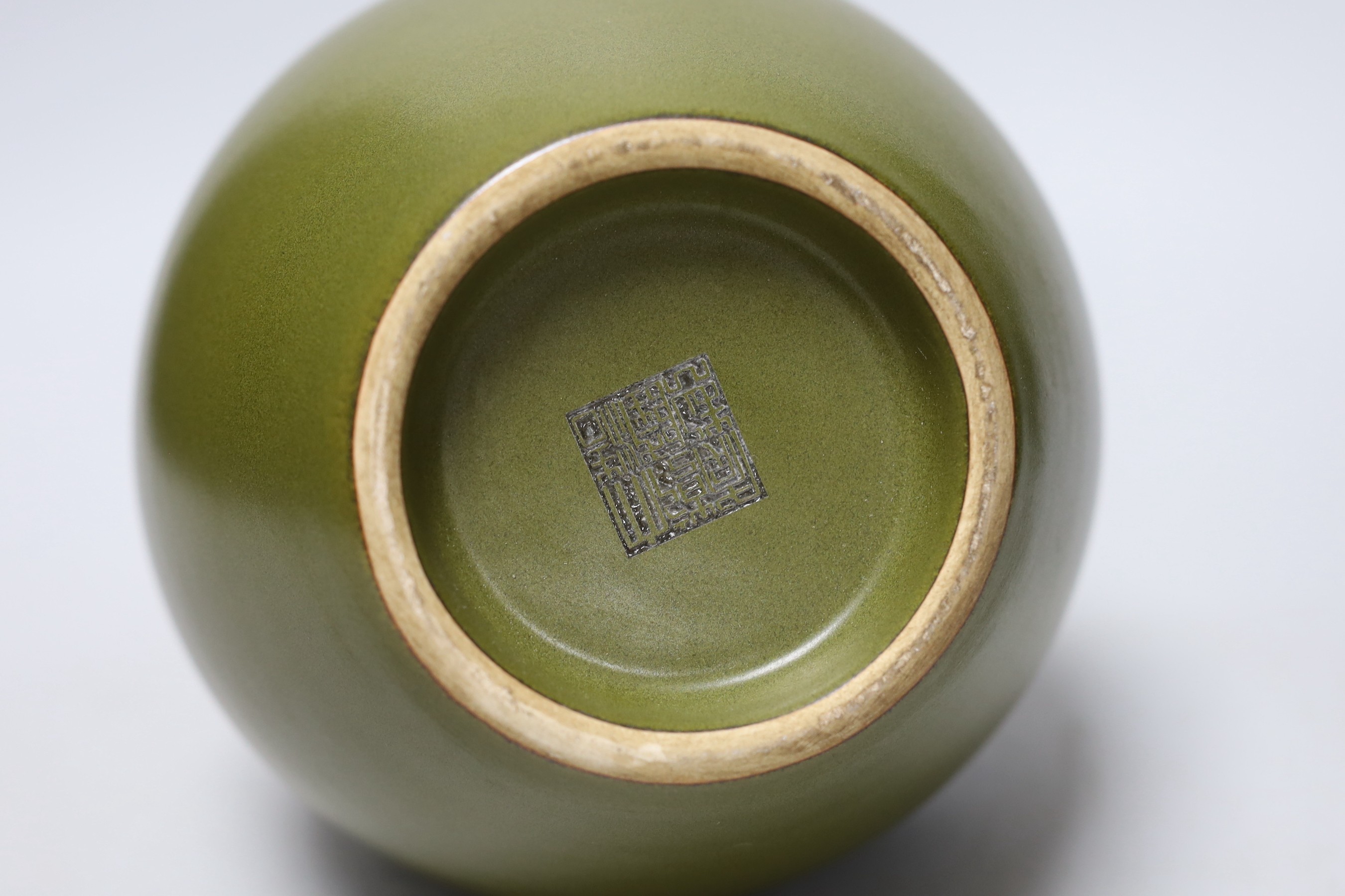 A Chinese olive green double gourd vase, 29cm high